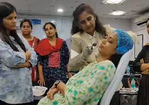 Dr Rajeshree Mayekar demonstrating dermaroller to the cosmetology batch